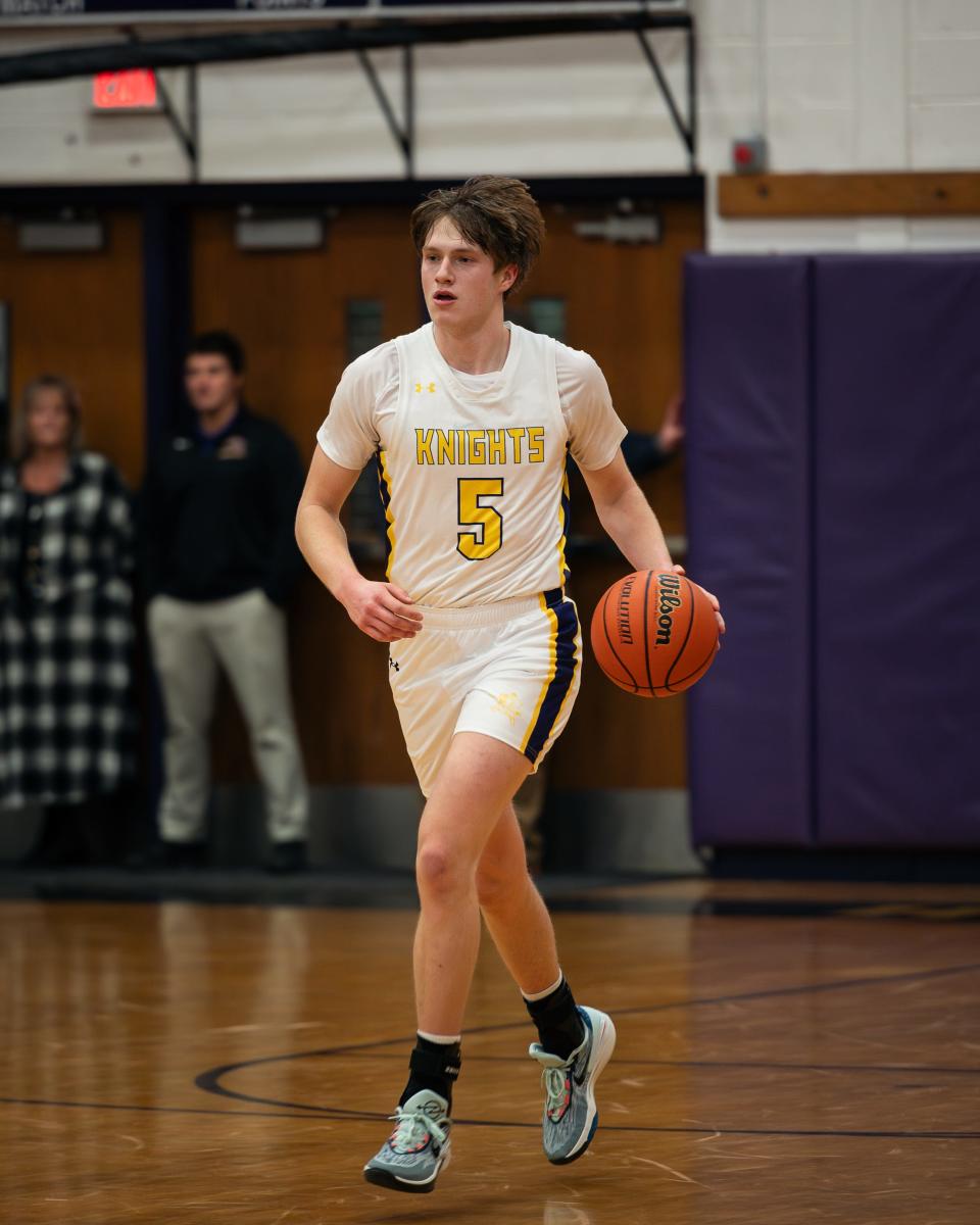 Holland Patent's Jeffrey Dewar dribbles the ball up the court during a Jan. 5 game against Central Valley Academy. The senior scoed his 1,000th career point at home Thursday against Proctor.