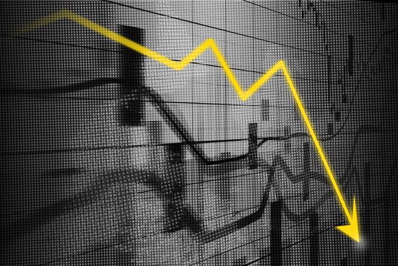 Stock market charts in black and white with a yellow arrow pointing downward.