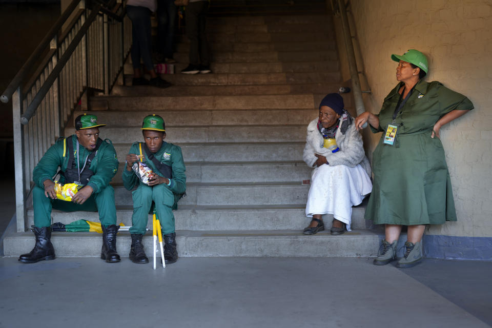 African National Congress Marshalls take a break as South African President Cyril Ramaphosa speaks at the Siyanqoba rally at FNB stadium in Johannesburg, South Africa, Saturday, May 25, 2024. South African will vote in the 2024 general elections May 29. (AP Photo/Jerome Delay)