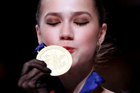 ISU World Figure Skating Championships - Saitama Super Arena, Saitama, Japan - March 22, 2019. Winner Russia's Alina Zagitova kisses her gold medal on the podium of the Ladies' competition. REUTERS/Issei Kato