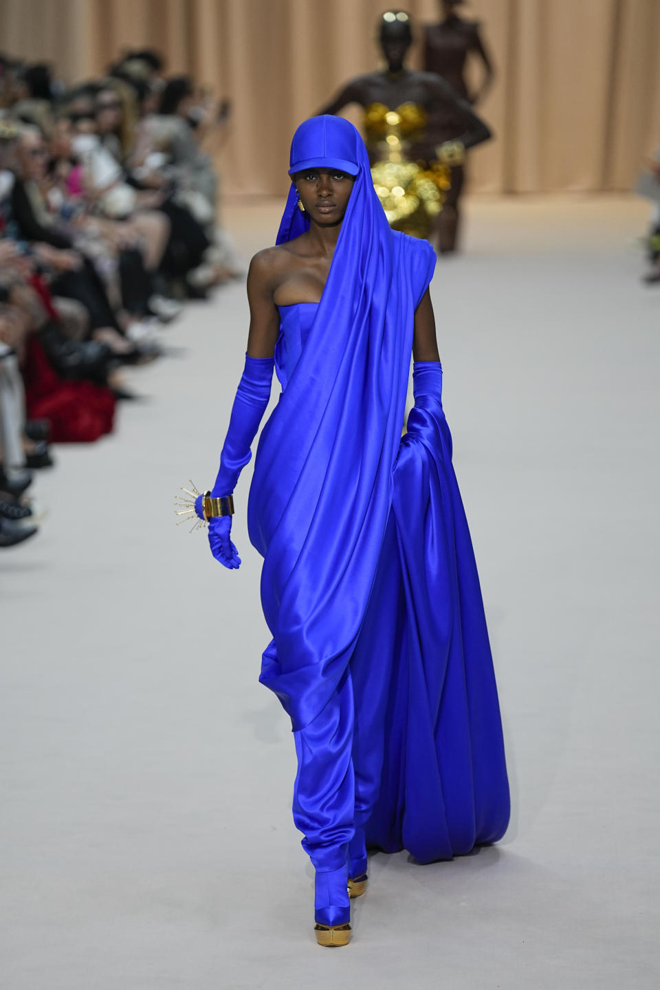 A model wears a creation as part of Jean Paul Gaultier's Haute Couture Fall/Winter 2022-2023 fashion collection presented Wednesday, July 6, 2022 in Paris. (AP Photo/Michel Euler)