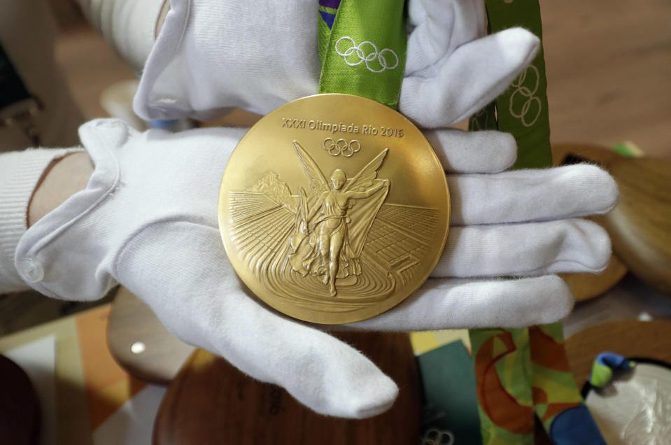 FILE - A Rio 2016 Olympic gold medal is displayed at the Olympic Park in Rio de Janeiro, Brazil, July 20, 2016. The medals were billed as the most sustainable ever produced, but a review of public records by The Associated Press found that the Sao Paulo-based company, Marsam Metais, processes gold for and shared ownership links to an intermediary accused by prosecutors of buying gold mined illegally on Indigenous lands and other areas deep in the Amazon rainforest. (AP Photo/David J. Phillip, File)