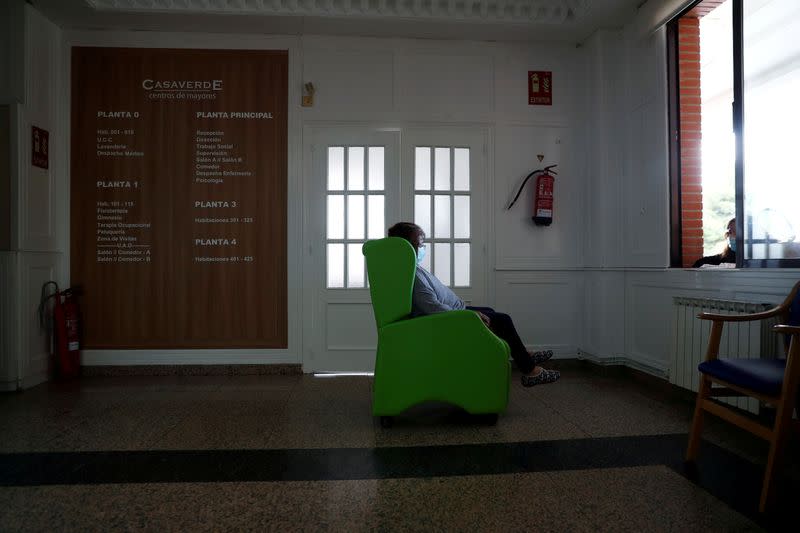 FILE PHOTO: Carmen Gonzalez talks to her daughter from a distance on the first day family visits are resumed after three months amid the coronavirus disease (COVID-19) outbreak at the nursing home Centro Casaverde in Navalcarnero