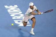 Tommy Paul of the U.S. plays a backhand return to Novak Djokovic of Serbia during their semifinal at the Australian Open tennis championship in Melbourne, Australia, Friday, Jan. 27, 2023. (AP Photo/Dita Alangkara)