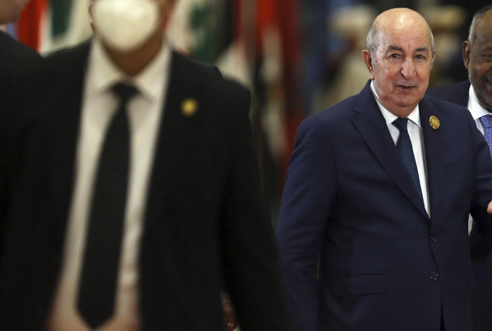 Algerian president Abdelmadjid Tebboune, centre, arrives to attend the Arab Summit, in Algiers, Algeria, Tuesday, 1 Nov., 2022. Arab leaders are meeting in Algeria at the 31st summit of the Arab League. They're seeking common ground on divisive issues in the region with the backdrop of rising inflation, food and energy shortages, drought and soaring cost of living across the Middle East and Africa. The 22-member League last held its summit in 2019. (AP Photo/Anis Belghoul)