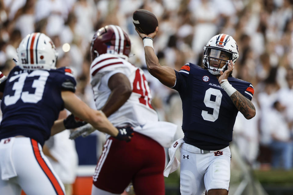 Auburn quarterback Robby Ashford (9) throws a pass against Massachusetts during the second half of an NCAA college football game Saturday, Sept. 2, 2023, in Auburn, Ala. (AP Photo/Butch Dill)