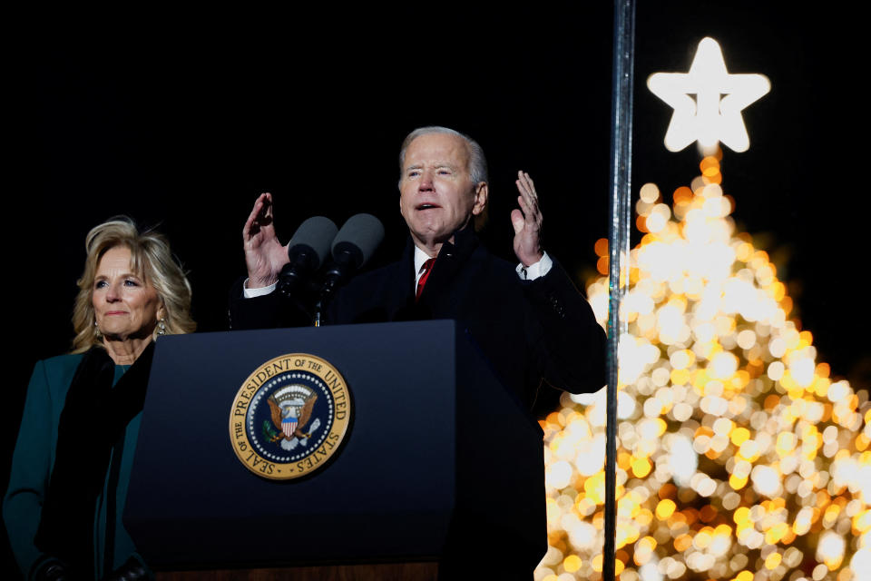 U.S. President Joe Biden speaks while first lady Jill Biden looks on during the National Christmas Tree Lighting Ceremony on Ellipse below the White House in Washington, D.C., U.S., November 30, 2022. REUTERS/Evelyn Hockstein