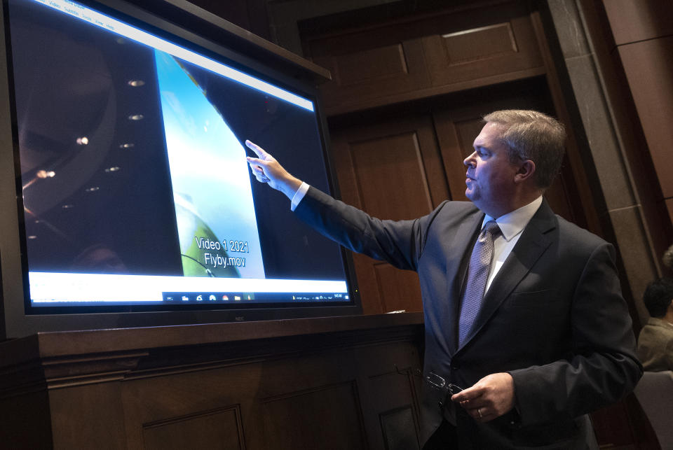 U.S. Deputy Director of Naval Intelligence Scott Bray points to a video of an Unidentified Aerial Phenomena, or UAP, as he testifies before the House Intelligence Committee on Capitol Hill in Washington, D.C., May 17, 2022. (Kevin Dietsch/Getty Images)