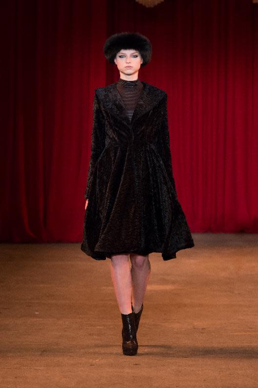 A model walks the runway during the Christian Siriano Fall 2013 fashion show during Fashion Week, Saturday, Feb. 9 2013, in New York. (AP Photo/Christian Siriano)