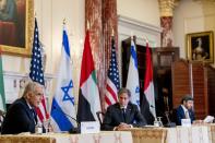 Israeli Foreign Minister Yair Lapid, left, accompanied by Secretary of State Antony Blinken, center, and United Arab Emirates Foreign Minister Sheikh Abdullah bin Zayed al-Nahyanin, right, speaks at a joint news conference at the State Department in Washington, Wednesday, Oct. 13, 2021. (AP Photo/Andrew Harnik, Pool)