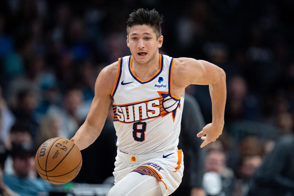 CHARLOTTE, NORTH CAROLINA - MARCH 15: Grayson Allen #8 of the Phoenix Suns brings the ball up court against the Charlotte Hornets during their game at Spectrum Center on March 15, 2024 in Charlotte, North Carolina. NOTE TO USER: User expressly acknowledges and agrees that, by downloading and or using this photograph, User is consenting to the terms and conditions of the Getty Images License Agreement. (Photo by Jacob Kupferman/Getty Images)