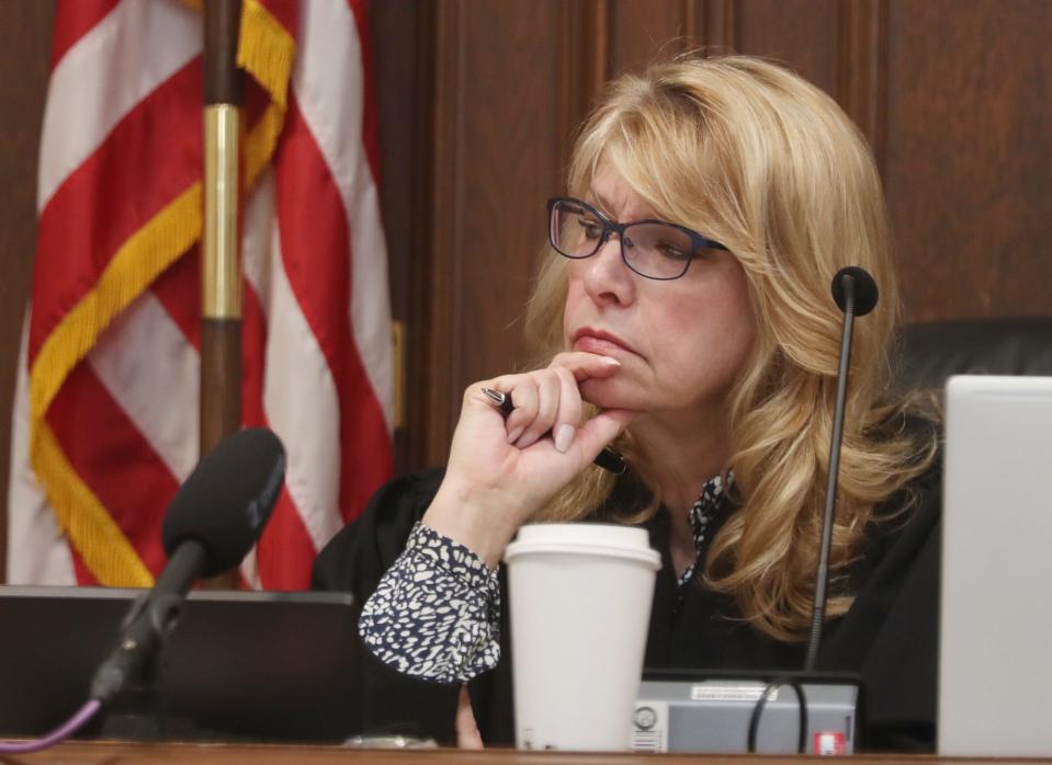 Summit County Common Pleas Judge Kelly McLaughlin listens to the testimony the prosecutor's witness, clinical psychologist Sylvia O'Bradovich of Summit Psychological Services, during the Sydney Powell trial in McLaughlin's courtroom. Powell is on trial for the stabbing death of her mother.