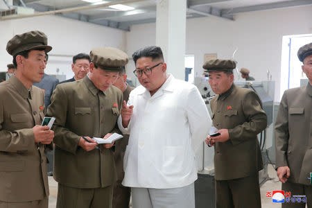 FILE PHOTO - North Korean leader Kim Jong Un gives field guidance during his visit to a machine factory under the Ranam Coal Mining Machine Complex in this undated photo released by North Korea's Korean Central News Agency (KCNA) in Pyongyang July 17, 2018. KCNA via REUTERS/File Photo