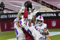 Arizona Cardinals wide receiver DeAndre Hopkins catches the game-winning touchdown as Buffalo Bills cornerback Tre'Davious White, center, free safety Jordan Poyer, right, and strong safety Micah Hyde, left, defend during the second half of an NFL football game, Sunday, Nov. 15, 2020, in Glendale, Ariz. The Cardinals won 32-20. (AP Photo/Ross D. Franklin)