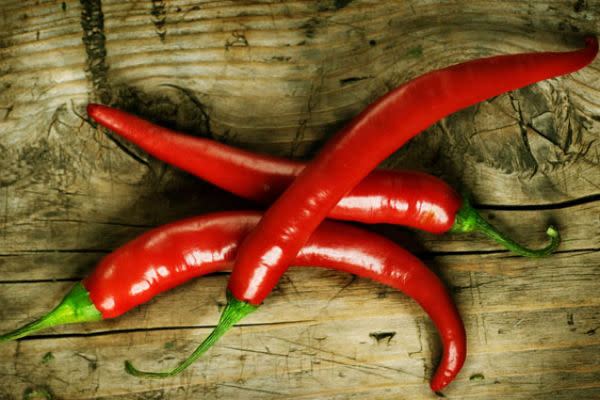 <p><b>3. Chillies </b> </p> <p> When people talk of chillies setting their hearts on fire, they don’t mean it lightly. Capsaicin, the essential compound that gives heat, is responsible for an influx of endorphins. This results in heightened blood circulation, stimulated nerves and an increased heart rate. A mere bite can imitate the state of arousal and make you sweaty and excited. </p>