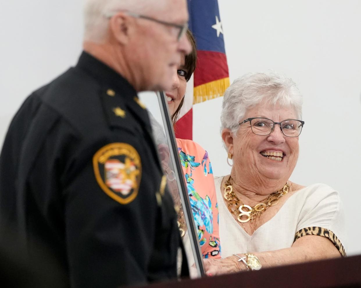 July 13, 2022; Columbus, Ohio, USA;  Sheriff Dallas Baldwin gifts a framed print to Sandy Karnes, wife of James A. Karnes for whom the new Franklin County Corrections Center is named.  Mandatory Credit: Barbara J. Perenic/Columbus Dispatch