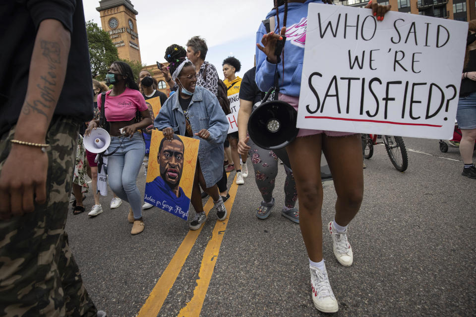 People march for the one year anniversary of George Floyd's death on Sunday, May 23, 2021, in Minneapolis, Minn. (AP Photo/Christian Monterrosa)