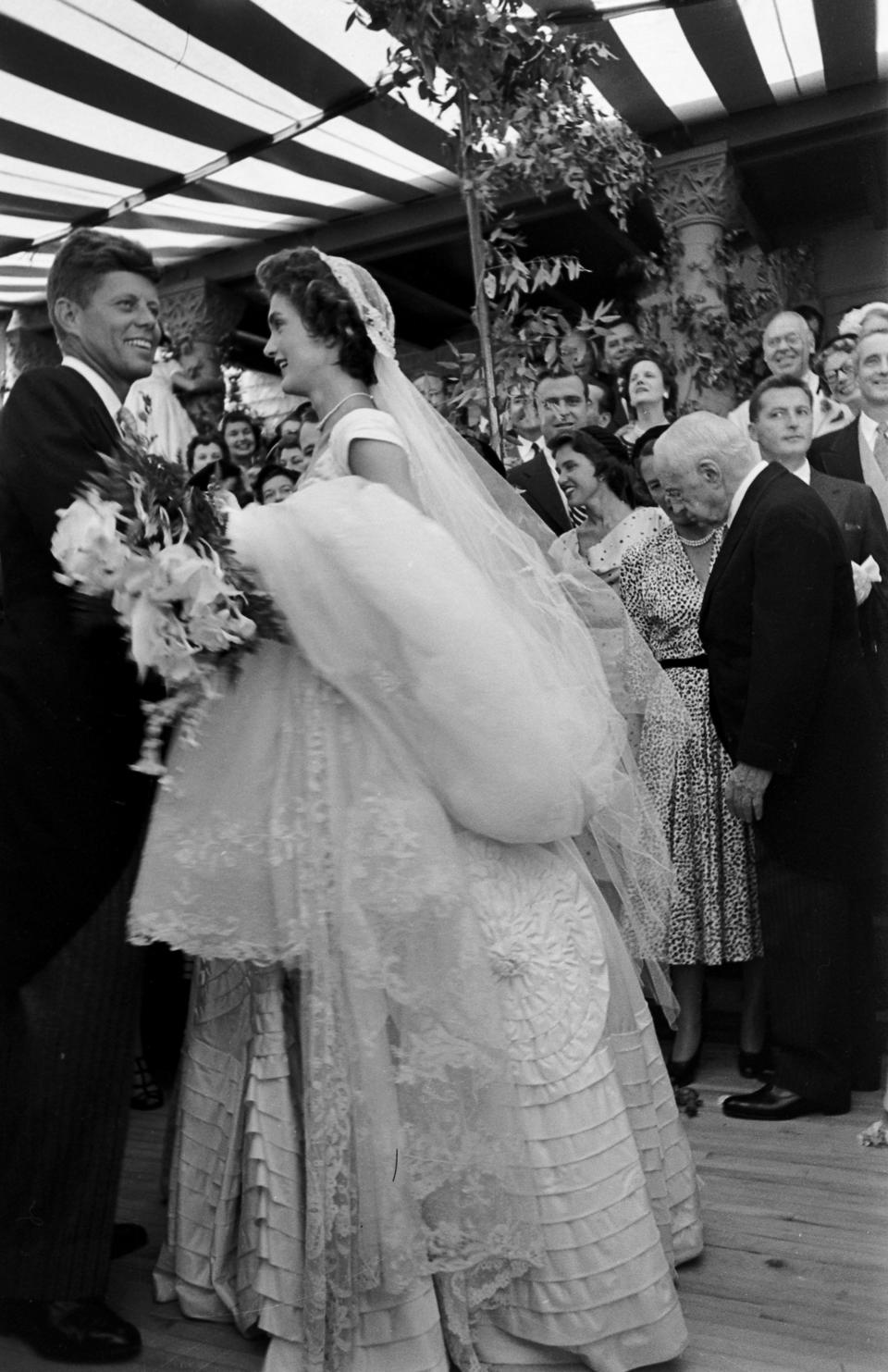 Future US President John F Kennedy (1917 - 1963) and Jacqueline Kennedy (1929 - 1994) (in a Battenburg wedding dress) take the first dance at their wedding reception, Newport, Rhode Island, September 12, 1953. (Photo by Lisa Larsen/Time & Life Pictures/Getty Images)