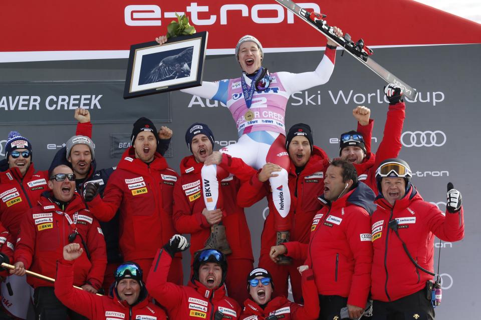 Switzerland's Marco Odermatt celebrates with teammates after he won the Men's World Cup super-G skiing race Friday, Dec. 6, 2019, in Beaver Creek, Colo. (AP Photo/John Locher)