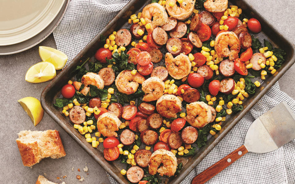 <p>Jennifer Davick</p><p>Cajun seasoning, chicken sausage and a few frozen veggies make this spectacular one-pan shrimp bake come together in just minutes. You'll have dinner on the table in no time!</p><p><strong>Get the Recipe: <a href="https://parade.com/873460/parade/sheet-pan-shrimp-bake/" rel="nofollow noopener" target="_blank" data-ylk="slk:Easy Sheet-Pan Shrimp Bake Recipe;elm:context_link;itc:0;sec:content-canvas" class="link ">Easy Sheet-Pan Shrimp Bake Recipe</a></strong></p>