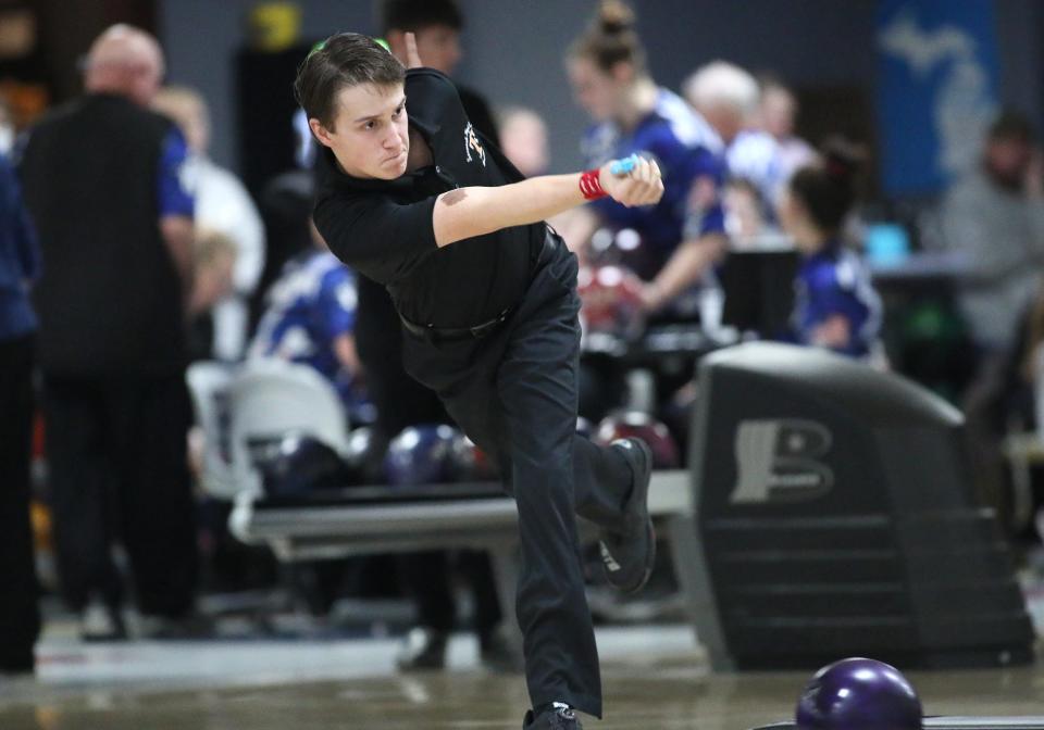 Tecumseh's Owen Williams rolls the ball during Thursday's dual against Adrian at Lenawee Rec.