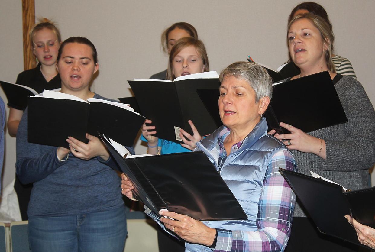 Community choir participants rehearsed this week for their upcoming Christmas celebration.