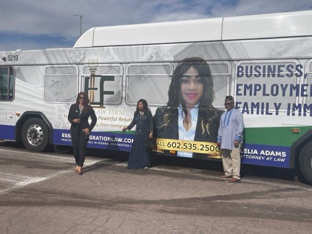 Lelia Adams, the first black woman to have her face on a Valley Metro bus, reveals her bus advertisement to her parents.