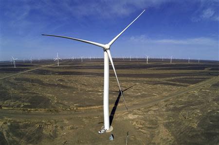 Wind turbines for generating electricity are seen at a wind farm in Guazhou, 950km (590 miles) northwest of Lanzhou, Gansu Province September 15, 2013. REUTERS/Carlos Barria
