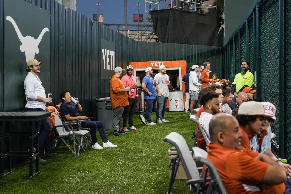 Fans watch Tuesday's Texas-Houston Christian game from the new Yeti Yard section in left field at UFCU Disch-Falk Field. For now, admission to the section is free. Texas had the sixth-best average attendance in the country last season.