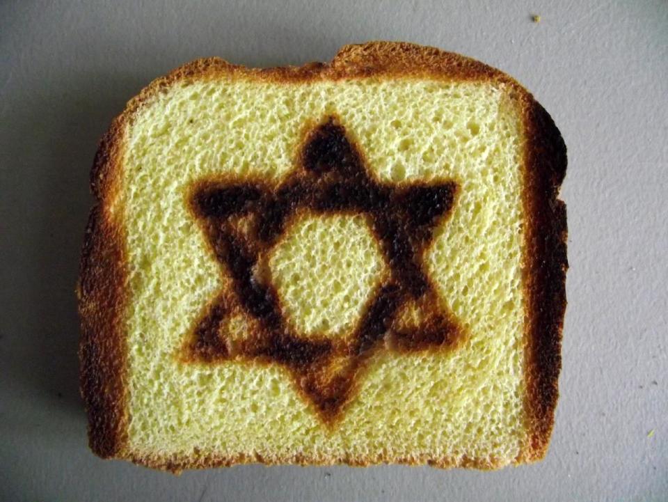This product image released by BurntImpressions.com shows toast with a Star of David symbol burned into it. The toast was made by a specialty Star of David Toaster. (AP Photo/BurntImpressions.com)