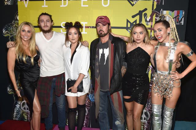 <p>John Shearer/Getty</p> Tish Cyrus, Braison Cyrus, Noah Cyrus, Billy Ray Cyrus, Brandi Cyrus and Miley Cyrus in 2015.