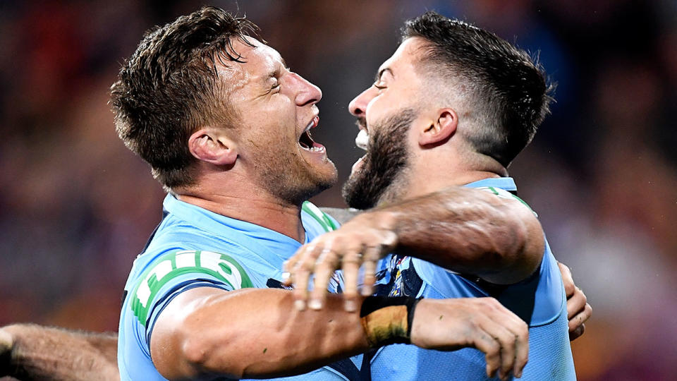 Tariq Sims and James Tedesco celebrate a try. Pic: Getty