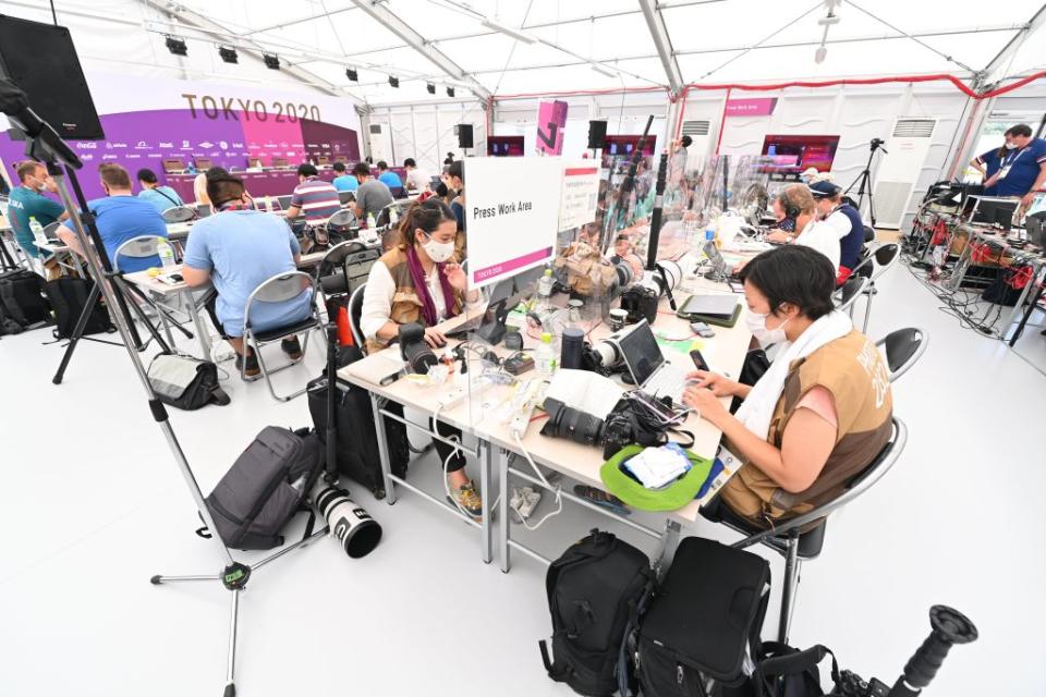 Media Workroom for journalists and photographers with social distancing to comply with COVID19 countermeasures during the Tokyo 2020 Summer Olympic Games on July 23, 2021 in Tokyo, Japan.<span class="copyright">Vincent Kalut—Photonews via Getty Images</span>