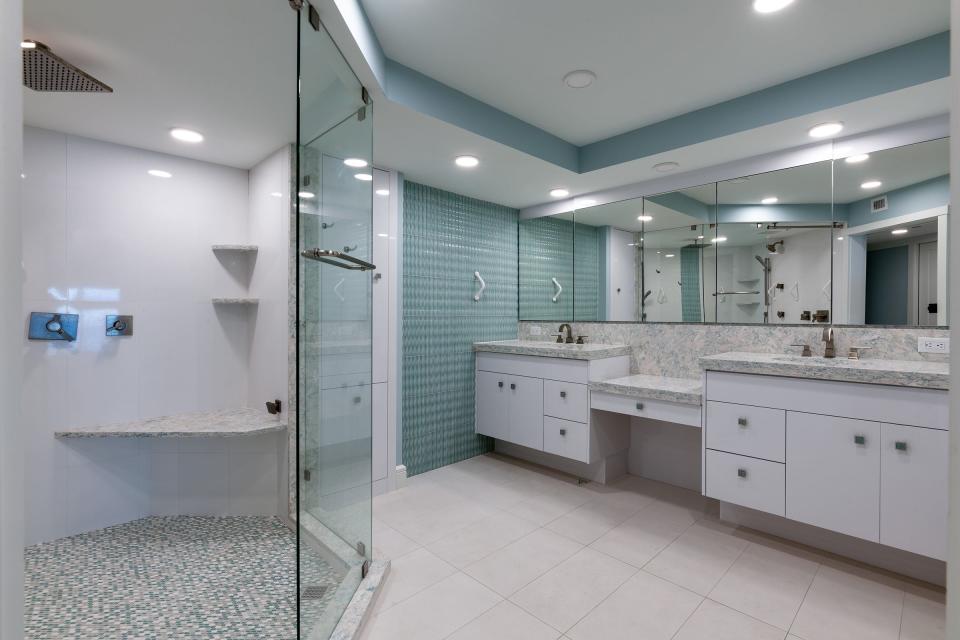 Featuring an oversized shower, the master bathroom has a vanity with twin sinks