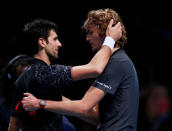 Tennis - ATP Finals - The O2, London, Britain - November 18, 2018 Germany's Alexander Zverev hugs Serbia's Novak Djokovic after winning the final Action Images via Reuters/Andrew Couldridge