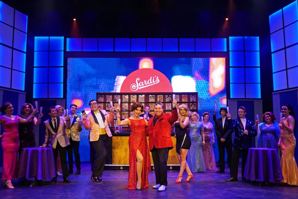 In the center dressed in red are Steven J. Heron as "Barry Glickman" and Mandy Kerridge as "Dee Dee Allen" in the musical "The Prom," playing at Titusville Playhouse through Oct. 1, 2023. Visit titusvilleplayhouse.com.