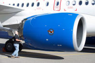 An employee inspects the engine of a C Series plane at Bombardier's plant in Mirabel, Quebec Canada, October 20, 2017. REUTERS/Christinne Muschi