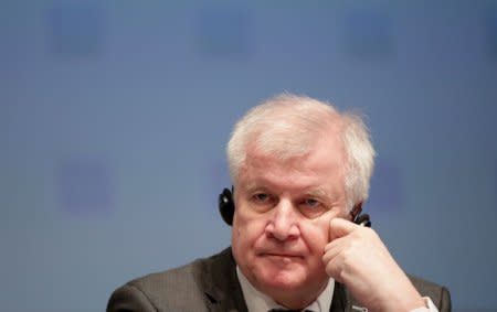 FILE PHOTO: Germany's Interior Minister Horst Seehofer attends a news conference after an informal meeting of EU's Home Affairs Ministers in Innsbruck, Austria, July 12, 2018. REUTERS/Lisi Niesner