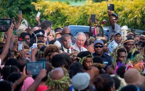 Thousands turned out to see Prince Charles visit the Nakamal, the traditional meeting place of the chiefs in Vanuatu - Credit: Steve Parsons/PA Wire