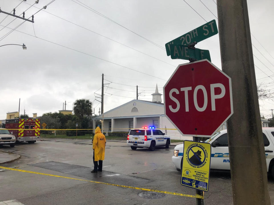 Law enforcement officials stand guard outside the Victory City Church in Riviera Beach, Fla., on Saturday, Feb. 1, 2020. Police say a fatal shooting happened after a funeral service at the church. (Hannah Morse/The Palm Beach Post via AP)