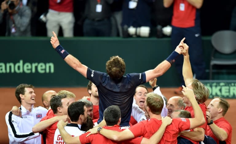 Britain's Andy Murray (C) celebrates with teammates after winning against Belgium's David Goffin to secure the Davis Cup final, the first for the country in 79 years