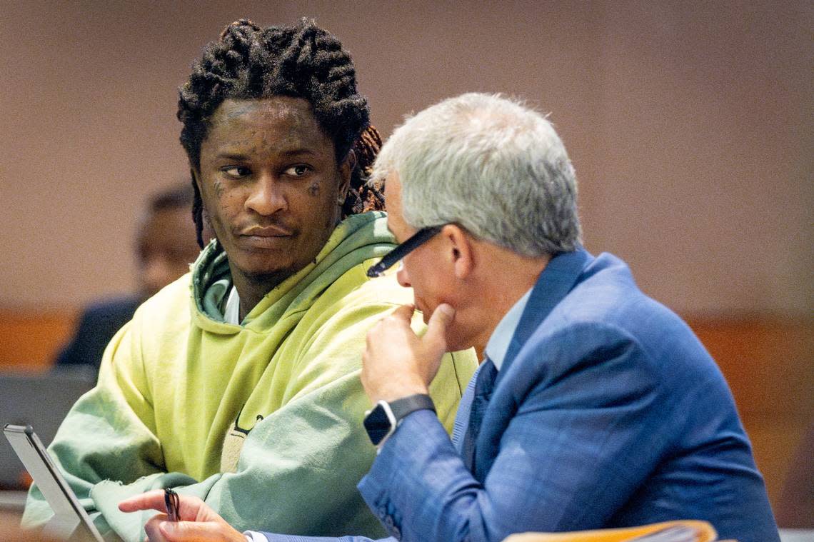 Atlanta rapper Young Thug talks to defense attorney Brian Steel during jury selection in the “Young Slime Life” gang case at the Fulton County Courthouse Tuesday, September 12, 2023.