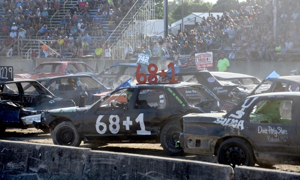 Kyle Goldsmith, 16, of LaSalle, in the 68+1 car, competes in his first demolition derby during an early heat in the 6 p.m. show Tuesday night at the 49th annual Monroe County Fair Demolition Derby. "He had a blast," said his father Aaron Goldsmith.