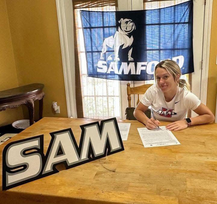 Jay's Ella Nelson signs her letter of intent to play softball at Samford University on Wednesday, Nov. 8, 2023.