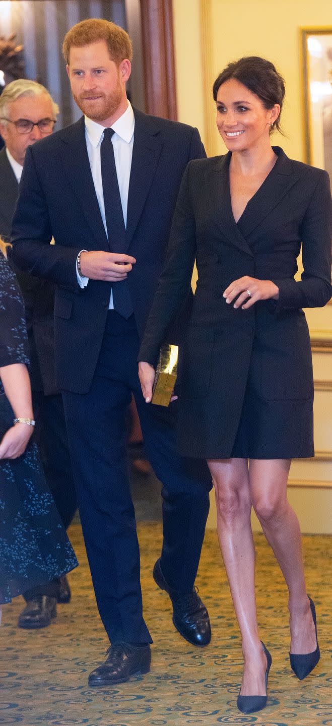 <p>For her date night with Prince Harry at a charity performance of Hamilton, Meghan Markle wore a stunning black tuxedo dress from Canadian brand <a href="https://www.judithandcharles.com/products/digital-dress?variant=13724510552106" rel="nofollow noopener" target="_blank" data-ylk="slk:Judith & Charles;elm:context_link;itc:0;sec:content-canvas" class="link ">Judith & Charles</a>. </p><p>The Duchess teamed the look with a pair of Paul Andrew's 'Pump-it-up' heels in black grosgrain with linen canvas (similar available <a class="link " href="https://www.farfetch.com/uk/shopping/women/paul-andrew-sling-back-stiletto-pumps-item-12186543.aspx?storeid=9689" rel="nofollow noopener" target="_blank" data-ylk="slk:here;elm:context_link;itc:0;sec:content-canvas">here</a>), 'Talon Earrings' by <a class="link " href="http://www.selfridges.com/GB/en/cat/shaun-leane-sterling-silver-and-gold-vermeil-talon-earrings_970-10179-SLS265/" rel="nofollow noopener" target="_blank" data-ylk="slk:Shaun Leane;elm:context_link;itc:0;sec:content-canvas">Shaun Leane</a> and a box clutch bag by Stella McCartney, September 2018.</p>