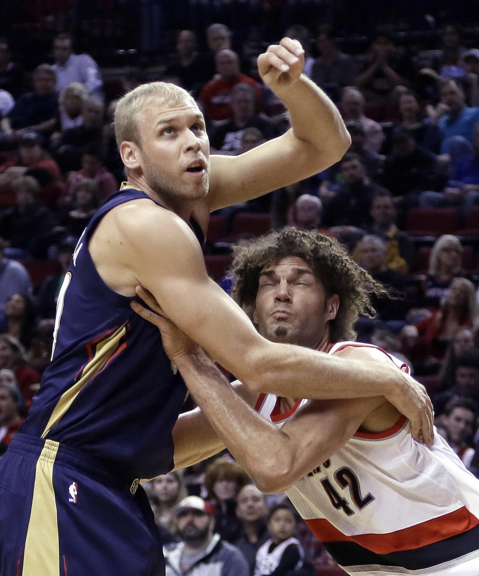 New Orleans Pelicans center Greg Stiemsma, left, and Portland Trail Blazers center Robin Lopez wait for a rebound during the first half of an NBA basketball game in Portland, Ore., Sunday, April 6, 2014. (AP Photo/Don Ryan)