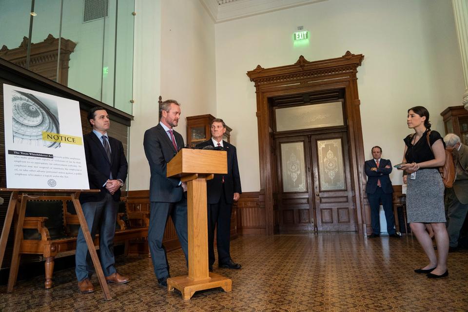 From left, whistleblowers Ryan Vassar, Blake Brickman and Mark Penley, former senior-level employees in the attorney general's office, speak at a news conference at the Capitol in September.
