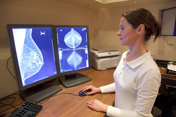 Doctor looking at a mammogram on a computer.