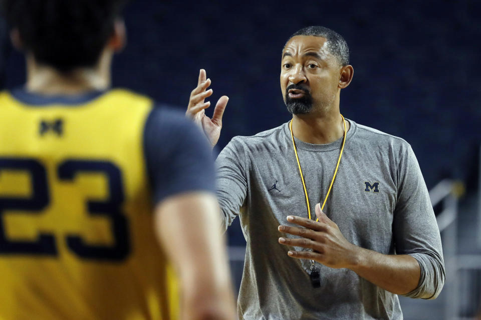 FILE - In this Thursday, Oct. 17, 2019, file photo, Michigan head coach Juwan Howard directs his team during NCAA college basketball practice in Ann Arbor, Mich. Howard took over his former team when he replaced John Beilein at Michigan. (AP Photo/Carlos Osorio, File)