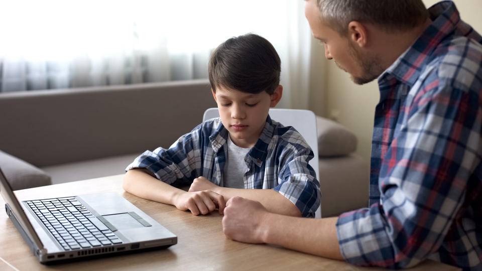 Dads and male carers can talk to sons about what's right from early on. (Getty)